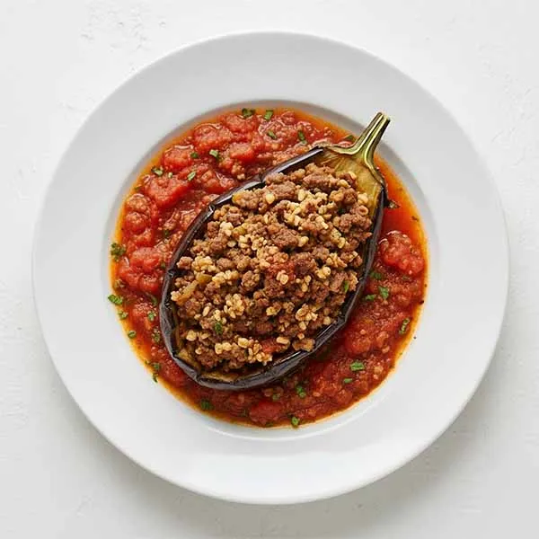 Beef Stuffed eggplant with cracked wheat & Mint Tomato Sauce